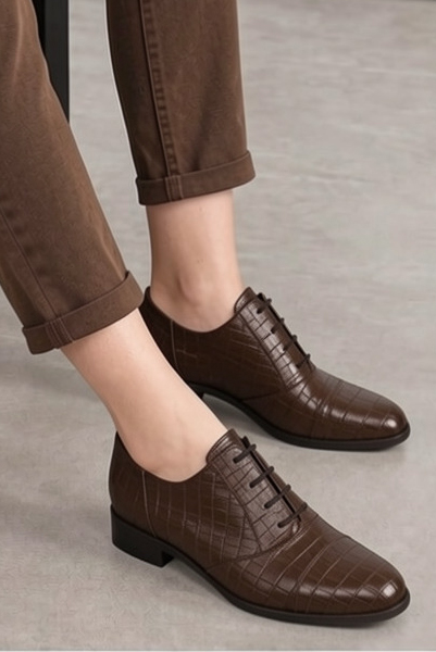 Women's dark brown classic oxfords and derby shoes with round toe and chunky rubber lug sole - Worn view